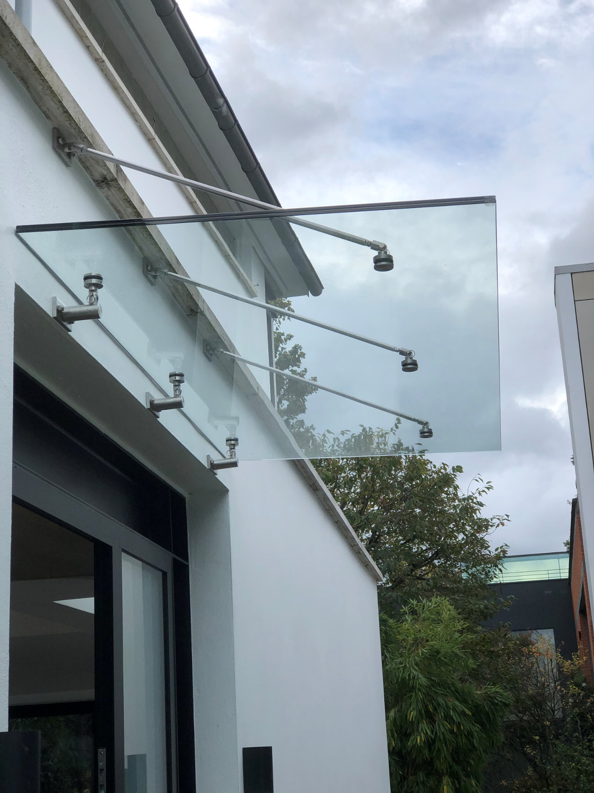 Glass canopy over a period front door